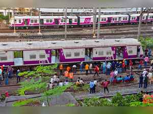 Mumbai: Restoration work underway after a local train derailed on the harbour li...
