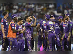 Mumbai: Kolkata Knight Riders players celebrates the wicket of Mumbai Indians pl...