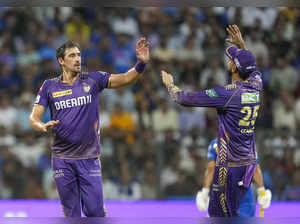 Mumbai: Kolkata Knight Riders bowler Mitchell Starc with teammates celebrates th...