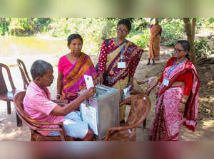 Malda: An elderly voter casts his vote through 'postal ballot' for Lok Sabha ele...
