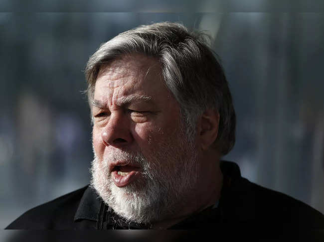 Steve Wozniak, co-founder of Apple, talks to people during a launch event in Cupertino