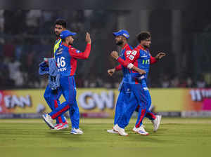 New Delhi: Delhi Capitals players celebrate the wicket of Rajasthan Royals batte...