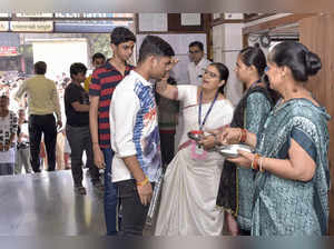 Surat, Mar 11 (ANI): Students being applied with 'tilak' as they arrive to appea...