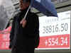 Japan's Nikkei edges higher on earnings, Wall Street gains