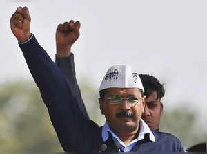 FILE PHOTO: Kejriwal, chief of AAP shouts slogans after taking the oath as the new chief minister of Delhi during a swearing-in ceremony at Ramlila ground in New Delhi