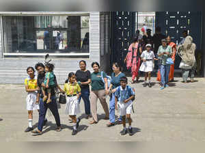 Ghaziabad: Students come out of the DPS School, Siddharth Vihar after a bomb thr...