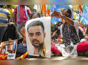 Bengaluru: NSUI members burn a poster of JD(S) MP Prajwal Revanna during a prote...