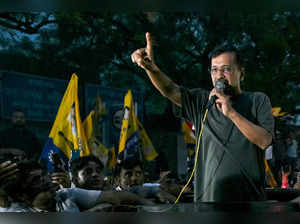 Arvind Kejriwal (R), chief minister of the capital Delhi and leader of Aam Aadmi Party (AAP) addresses his supporters and party members upon his release from the prison on interim bail in New Delhi on May 10, 2024.