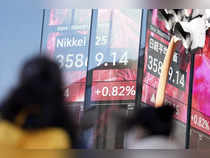 Japanese shares fall ahead of earnings reports; rising yields weigh