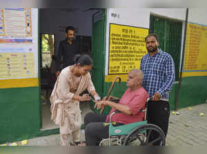 Fatehpur Sikri: A senior citizen gets his finger marked with indelible ink befor...