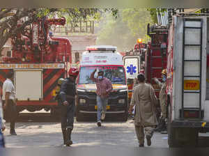 New Delhi: Emergency services personnel at the spot after a fire broke out at th...
