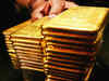 Gold prices edge lower as traders eye US data for Fed clues