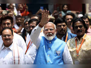 Indian Prime Minister Narendra Modi waves to supporters after filing his nomination papers to recontest the parliamentary seat in Varanasi on May 14, 2024, during the country's ongoing general election.