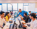 IT firms in India are deploying new tricks to lure staff to :Image