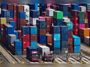 This aerial photograph taken on May 14, 2024 shows shipping containers stacked at a port in Qingdao, in eastern China's Shandong province.