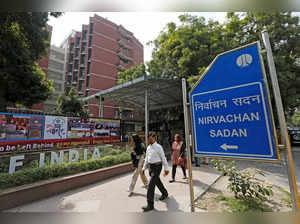FILE PHOTO: People walk past the Election Commission of India office building in New Delhi