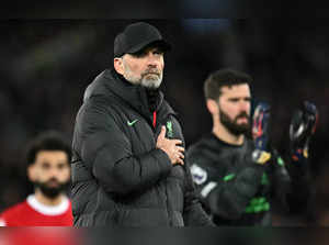 Liverpool's German manager Jurgen Klopp applauds the fans following the English Premier League football match between Everton and Liverpool at Goodison Park in Liverpool, north west England on April 24, 2024.
