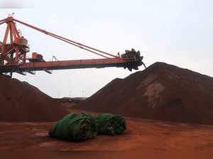 FILE PHOTO: Machine works on blending the iron ore at Dalian Port