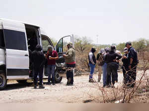 Members of the Missing Persons Search State Commission talk on a van in Abasolo, Guanajuato State, Mexico on May 15, 2024.