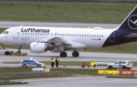 Climate activists glue themselves at Munich airport to protest pollution caused by flying