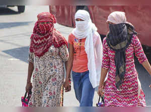Meerut: Women during a hot summer day, in Meerut. (PTI Photo) (...