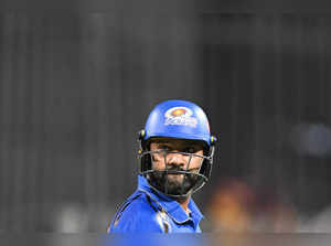 Mumbai Indians' Rohit Sharma reacts as he walks back to the pavilion after his dismissal during the Indian Premier League (IPL) Twenty20 cricket match between Kolkata Knight Riders and Mumbai Indians at the Eden Gardens in Kolkata on May 11, 2024.