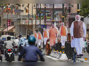 Ayodhya: Cutouts of Prime Minister Narendra Modi and Uttar Pradesh Chief Ministe...