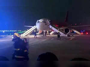 Air India plane forced to make an emergency landing after its engine erupted into flames, with 179 passengers on board