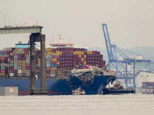 Tugboats escort the cargo ship Dali after it was refloated in Baltimore. The ves...