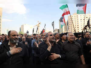 People gather to mourn for the death of the late Iran's President Ebrahim Raisi, in Tehran