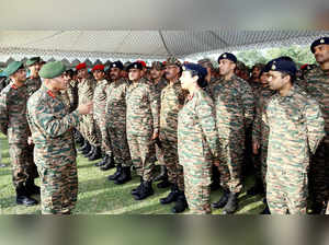 Udhampur, May 12 (ANI): Indian Army Chief General Manoj Pande interacts with arm...