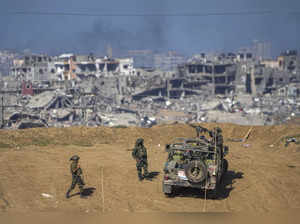 Israeli army troops are seen near the Gaza Strip border, in southern Israel. The...