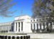 Fed officials urge patience on timing of initial rate cut