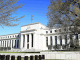 Fed officials urge patience on timing of initial rate cut