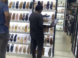 Multitasking with shopping: Bengaluru techie's photo attending office meeting while shopping sandals:Image