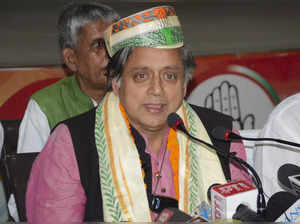 Patna: Congress leader Shashi Tharoor addresses a press conference, in Patna. (P...