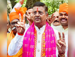 Prayagraj, May 01 (ANI): BJP candidate from Prayagraj, Neeraj Tripathi shows a v...