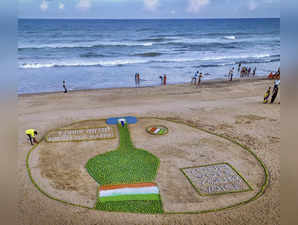 Puri: Renowed sand artist Sudarsan Pattnaik creates a sand sculpture to spread v...