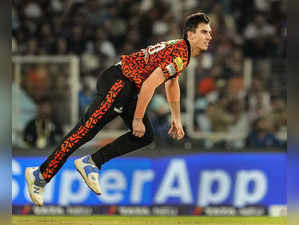 Ahmedabad: Sunrisers Hyderabad's Pat Cummins bowls a delivery during the Indian ...