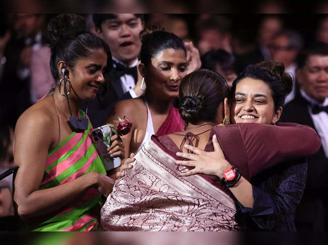 Indian director Payal Kapadia celebrates with her cast after she was awarded with the Grand Prix for the film "All We Imagine as Light" during the Closing Ceremony at the 77th edition of the Cannes Film Festival in Cannes, southern France, on May 25, 2024.