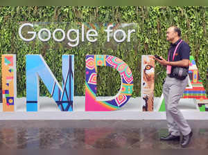 A man walks past the sign of "Google for India", the company's annual technology event in New Delhi