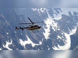 Chamoli: A helicopter on its way to Badrinath Temple, during the 'Char Dham Yatr...