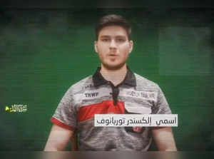 An image grab from a video released by the Palestinian militant group Islamic Jihad on May 28, 2024, shows an Israeli hostage held in Gaza, identified by Israeli media as 28-year-old Russian-Israeli hostage Sasha Trupanov, speaking to the camera.