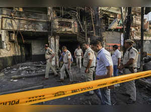 New Delhi: Police personnel investigate at the Baby Care Hospital after a fire b...