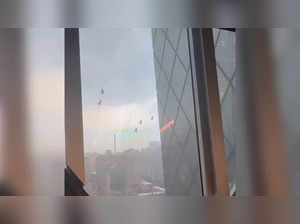 Window Washers dangle from famous tower in severe storm; watch video