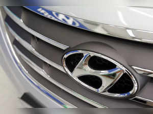 FILE PHOTO: The logo of Hyundai Motor is seen on a car displayed at a Hyundai dealership in Seoul