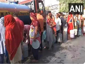 People wait in long queues as Delhi continues to grapple with water shortage:Image