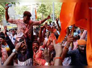 Shiv Sena (Uddhav Balasaheb Thackeray) supporters celebrate after election results outside the party office in Mumbai