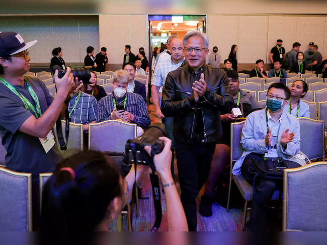 FILE PHOTO: Nvidia CEO Jensen Huang arrives at an event at COMPUTEX forum in Taipei