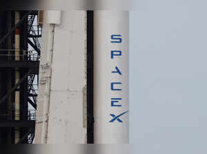 The SpaceX logo is shown on a Falcon 9 rocket as it is prepared for launch to carry NASA's SpaceX Crew-8 astronauts